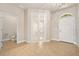 Inviting foyer features neutral paint, tile floors, and elegant French doors leading to an office at 1923 Mendocino Ln, Port Orange, FL 32128