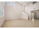 Open-concept living room with high ceilings, tile flooring, and plenty of natural light at 1923 Mendocino Ln, Port Orange, FL 32128