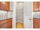 Walk-in pantry with wire shelving provides ample storage space in the kitchen at 1923 Mendocino Ln, Port Orange, FL 32128