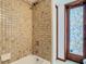 The bathroom features a tiled shower and a decorative, vintage stained glass door at 200 Alpine St, Altamonte Springs, FL 32701