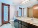 Bathroom boasts and sinks, a shower and stained glass door at 200 Alpine St, Altamonte Springs, FL 32701