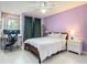 This bedroom has a calming feel, with a light lavender wall, a ceiling fan, and a workstation at 200 Alpine St, Altamonte Springs, FL 32701