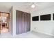 This bedroom is very spacious with a door leading into another room and 3 large screen TVs at 200 Alpine St, Altamonte Springs, FL 32701