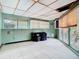 Bonus room with a large window, tiled floors, an AC unit, and ample storage at 200 Alpine St, Altamonte Springs, FL 32701