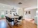 Dining room with wood floors, modern light fixture and view into other rooms at 200 Alpine St, Altamonte Springs, FL 32701