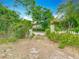 Driveway entrance framed by overgrown foliage and greenery at 200 Alpine St, Altamonte Springs, FL 32701