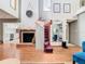 Open concept foyer with fireplace and stairway, hardwood floors, and soaring ceilings at 200 Alpine St, Altamonte Springs, FL 32701