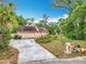 Exterior view of a home with a two-car garage and a long driveway at 200 Alpine St, Altamonte Springs, FL 32701