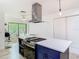 Bright and airy kitchen showcasing a cooking island with bar seating and modern stainless steel range at 200 Alpine St, Altamonte Springs, FL 32701