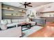 Living room with a large sectional sofa, wood floors, and modern décor at 200 Alpine St, Altamonte Springs, FL 32701