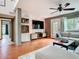 Cozy living room with hardwood floors, a ceiling fan, and a large window at 200 Alpine St, Altamonte Springs, FL 32701