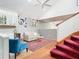 Well lit living room with a vaulted ceiling, open floor plan, bar and a staircase at 200 Alpine St, Altamonte Springs, FL 32701