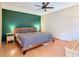 This spacious main bedroom has an accent wall and warm wood tones at 200 Alpine St, Altamonte Springs, FL 32701