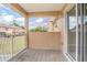 A tan balcony overlooks a grassy area and other residential buildings at 201 Dyson Dr, Deland, FL 32724