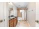 Clean bathroom with vanity, shower and tub combo, and ceramic tile flooring at 201 Dyson Dr, Deland, FL 32724