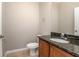 Well-lit bathroom with granite countertop vanity, ceramic tile flooring, and ample lighting at 201 Dyson Dr, Deland, FL 32724