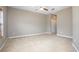 Bright bedroom with neutral carpet, ceiling fan, and closet space at 201 Dyson Dr, Deland, FL 32724