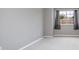 Bright bedroom with gray walls, carpet flooring, and large window with curtains at 201 Dyson Dr, Deland, FL 32724