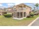 A townhome features a screened in porch and balcony at 201 Dyson Dr, Deland, FL 32724