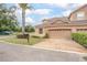A townhouse with brick driveway features an attached two-car garage at 201 Dyson Dr, Deland, FL 32724