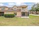 A townhome boasts a screened in porch and outdoor balcony at 201 Dyson Dr, Deland, FL 32724