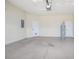 Spacious two car garage featuring a water heater and electrical panel at 201 Dyson Dr, Deland, FL 32724
