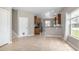 Open-concept living area with tile flooring and view to the kitchen at 201 Dyson Dr, Deland, FL 32724