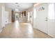 Open-concept living area with tile flooring and front door at 201 Dyson Dr, Deland, FL 32724