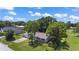 Aerial view showcasing the home's location, surrounding greenery, and neighborhood at 2106 Umbrella Tree Dr, Edgewater, FL 32141