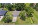 Aerial view of the property showcasing the home, yard, and neighborhood at 2106 Umbrella Tree Dr, Edgewater, FL 32141
