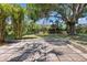Enjoy outdoor living on the paver patio surrounded by privacy and mature trees at 2106 Umbrella Tree Dr, Edgewater, FL 32141