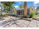 Paver patio and screened-in lanai offer a relaxing outdoor living space at 2106 Umbrella Tree Dr, Edgewater, FL 32141