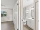 Updated bathroom features a modern vanity and a view into the bedroom at 2106 Umbrella Tree Dr, Edgewater, FL 32141