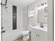 Renovated bathroom showcases a bathtub and shower combination and updated vanity at 2106 Umbrella Tree Dr, Edgewater, FL 32141