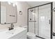 Contemporary bathroom features a walk-in shower with sleek black accents at 2106 Umbrella Tree Dr, Edgewater, FL 32141