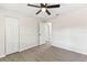 Bright bedroom featuring updated flooring, a ceiling fan, and neutral paint at 2106 Umbrella Tree Dr, Edgewater, FL 32141