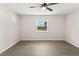 Bright bedroom featuring a ceiling fan and a window with outside views at 2106 Umbrella Tree Dr, Edgewater, FL 32141
