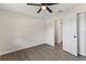 Cozy bedroom with a ceiling fan, natural light, and closet space at 2106 Umbrella Tree Dr, Edgewater, FL 32141