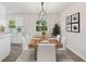Cozy dining area featuring gray flooring, modern decor, adjacent to kitchen, perfect for Gathering meals at 2106 Umbrella Tree Dr, Edgewater, FL 32141