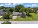 Charming single-story home with well-maintained lawn and mature trees at 2106 Umbrella Tree Dr, Edgewater, FL 32141
