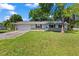 Lovely home with a well-manicured lawn and inviting front entrance at 2106 Umbrella Tree Dr, Edgewater, FL 32141