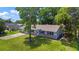 This home features a well-kept lawn and a classic brick facade at 2106 Umbrella Tree Dr, Edgewater, FL 32141