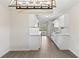 Updated kitchen with white cabinets, quartz countertops, and modern appliances creates a bright and inviting space at 2106 Umbrella Tree Dr, Edgewater, FL 32141