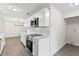 Beautiful kitchen showcasing stainless steel appliances, white cabinetry, quartz countertops, and modern lighting fixtures at 2106 Umbrella Tree Dr, Edgewater, FL 32141