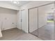 Convenient laundry room providing access to the outside porch via sliding glass door at 2106 Umbrella Tree Dr, Edgewater, FL 32141