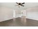 Open living room showcases gray flooring, with views to kitchen, offering a seamless flow and ample space at 2106 Umbrella Tree Dr, Edgewater, FL 32141