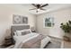 Comfortable primary bedroom with a neutral color palette and accent rug at 2106 Umbrella Tree Dr, Edgewater, FL 32141