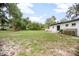 Expansive backyard featuring lush greenery and a well-maintained lawn at 2215 Lake Ruby Rd, Deland, FL 32724