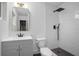 Updated bathroom with a modern vanity, toilet, and walk-in shower at 2215 Lake Ruby Rd, Deland, FL 32724