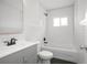 Bright bathroom featuring updated vanity, tiling and tub at 2215 Lake Ruby Rd, Deland, FL 32724